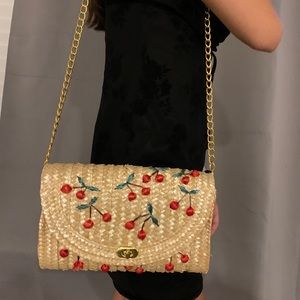 Straw cross body bag with cherry detailing